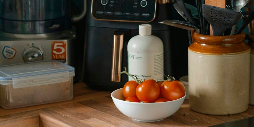 Small kitchen appliances lined up on a counter